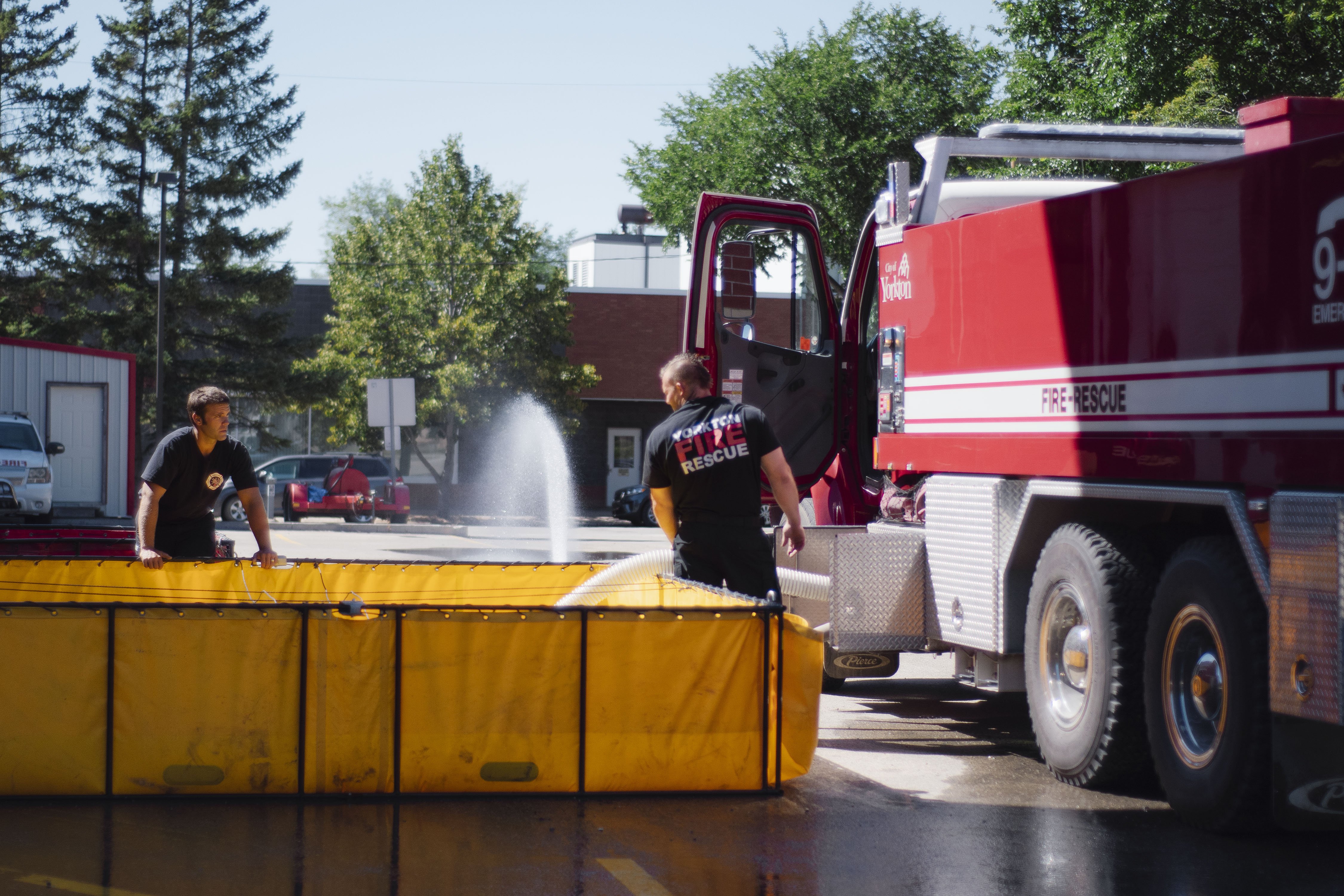 firefighters testing water hose