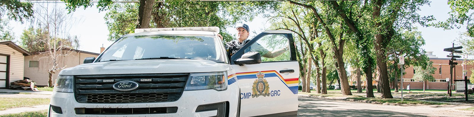 RCMP officer with RCMP vehicle